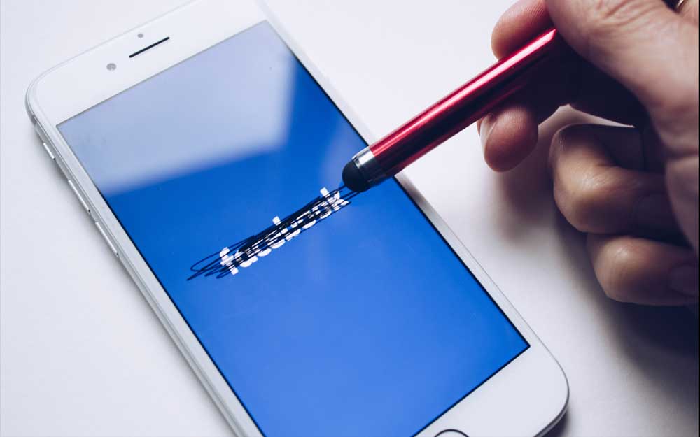 Facebook app on phone being erased by stylus - blockchain data privacy